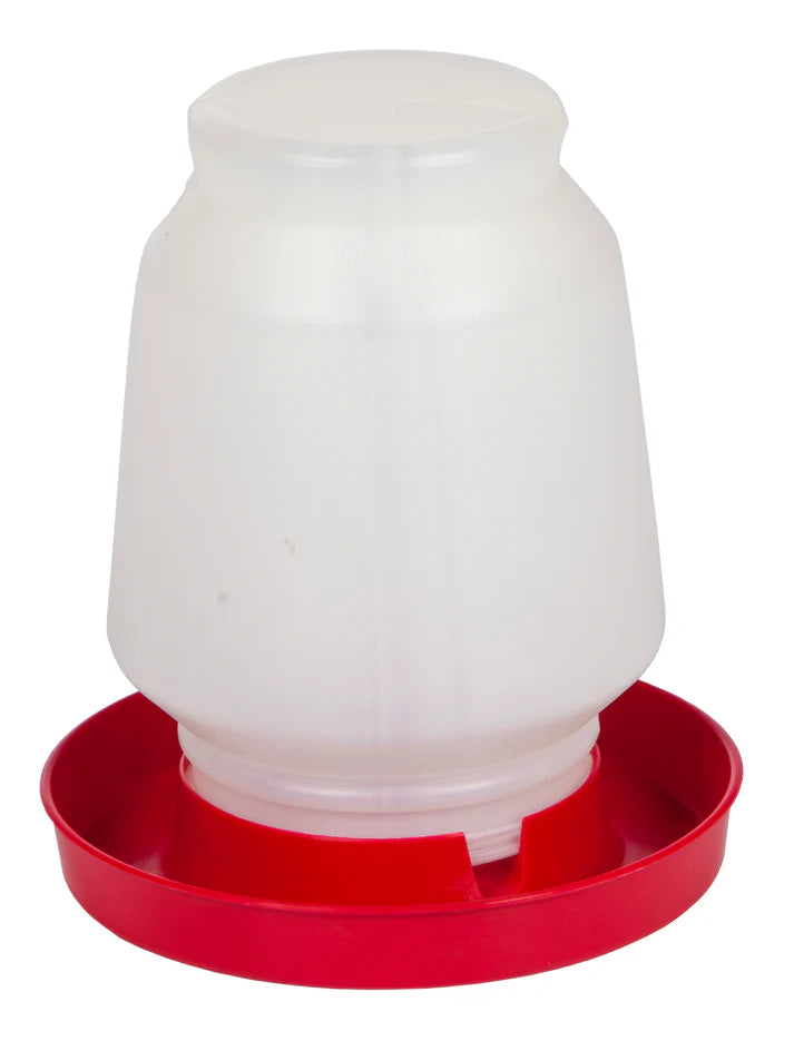 White plastic poultry feeder with red base on a white background